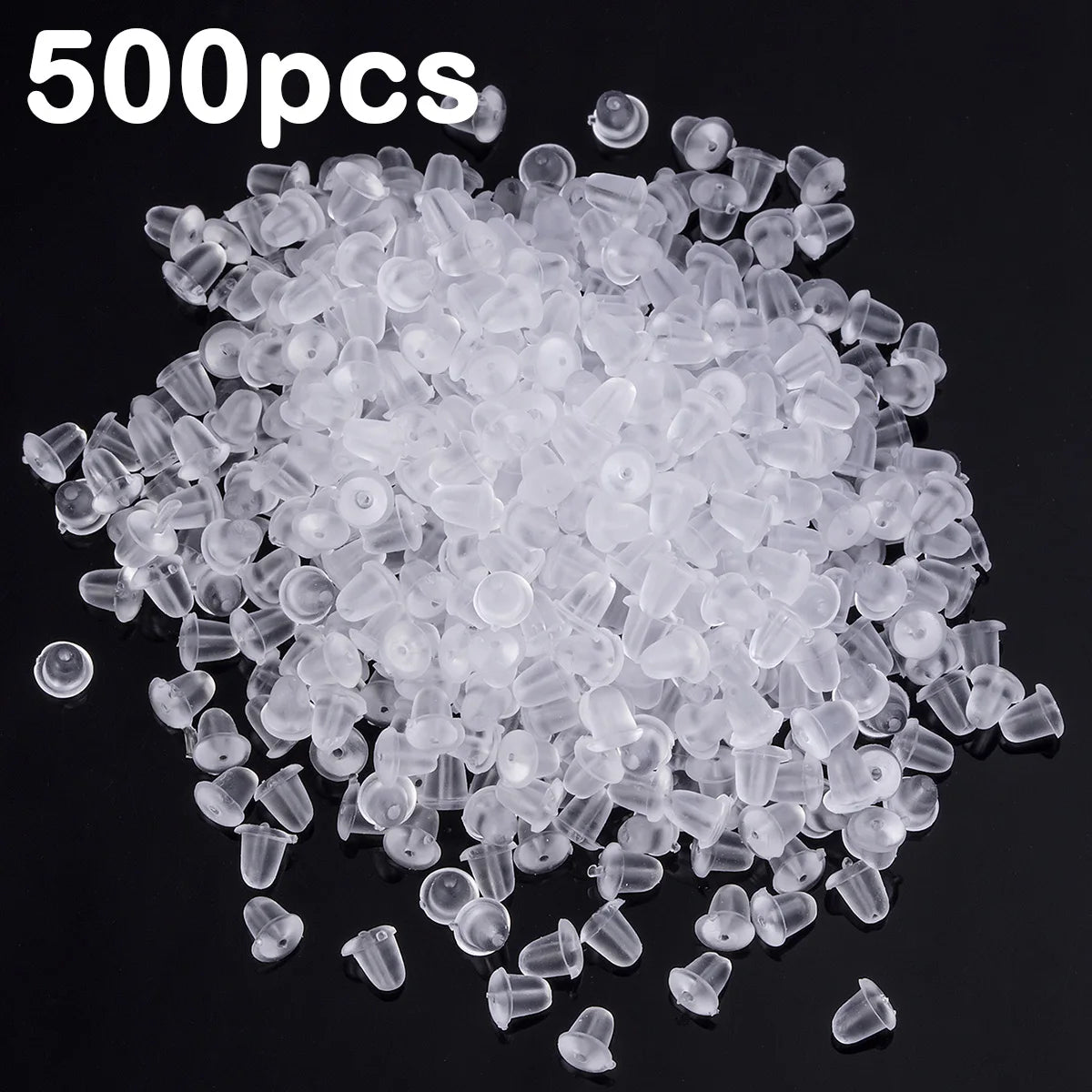 A pile of clear silicone earring backs for secure stud closure.