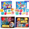 A box of squishy toys featuring various fruit and animal shapes including strawberries, apples, and a pink cat.
