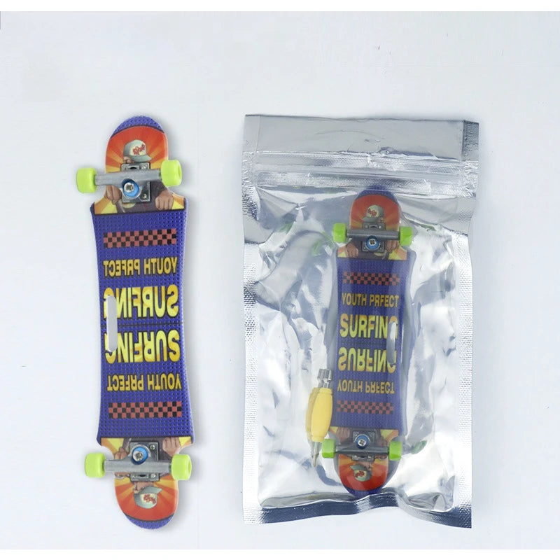 A finger skateboard is shown, packaged in a clear plastic bag with a purple and yellow design.