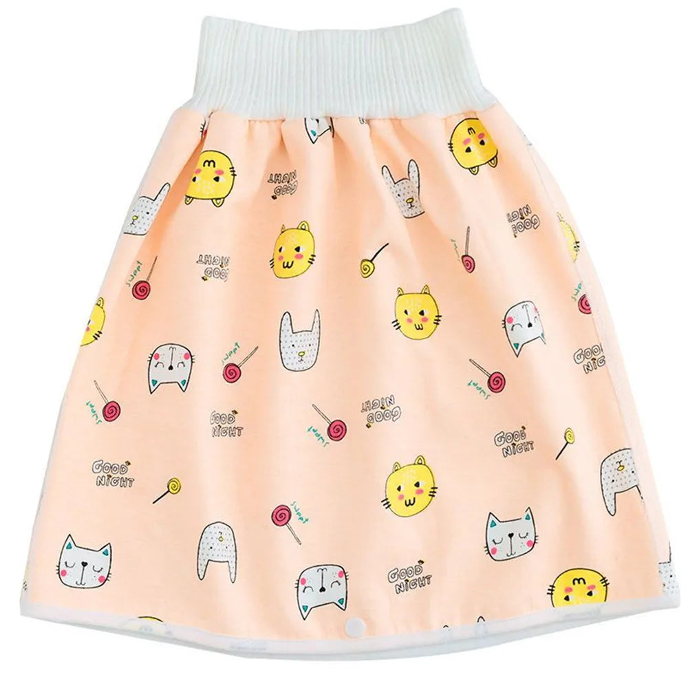 A light peach waterproof baby diaper pants with a matching skirt featuring cute animal faces for potty training.