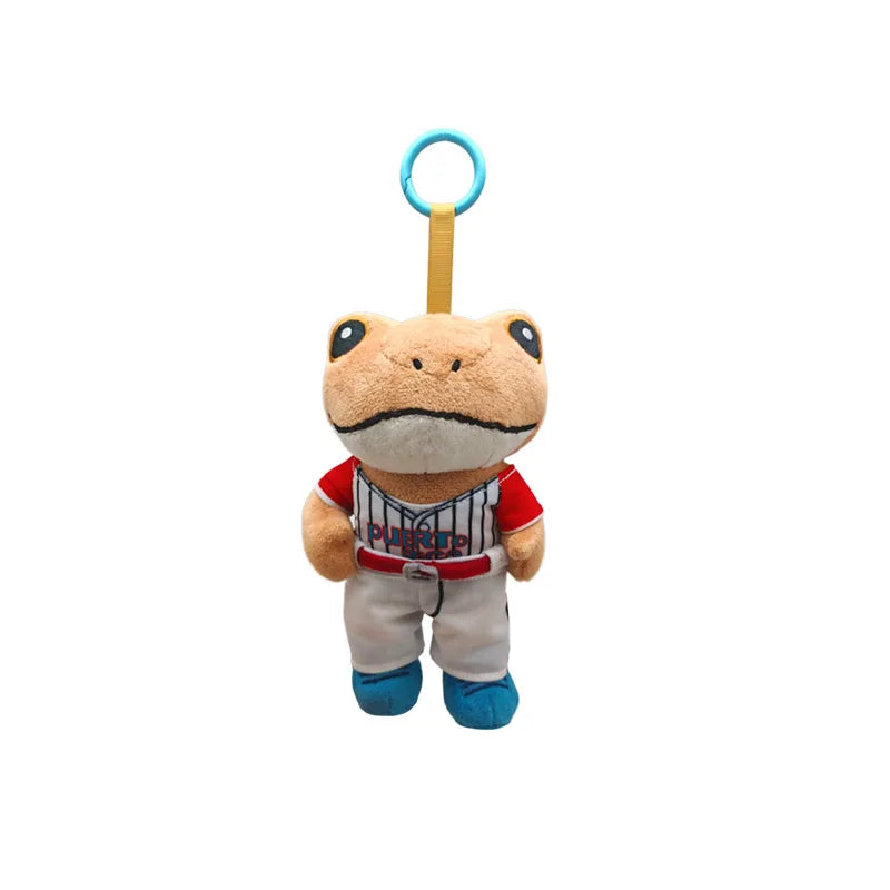 A cute plush frog doll with blue eyes, wearing a red and white striped jersey, hanging from a blue loop.