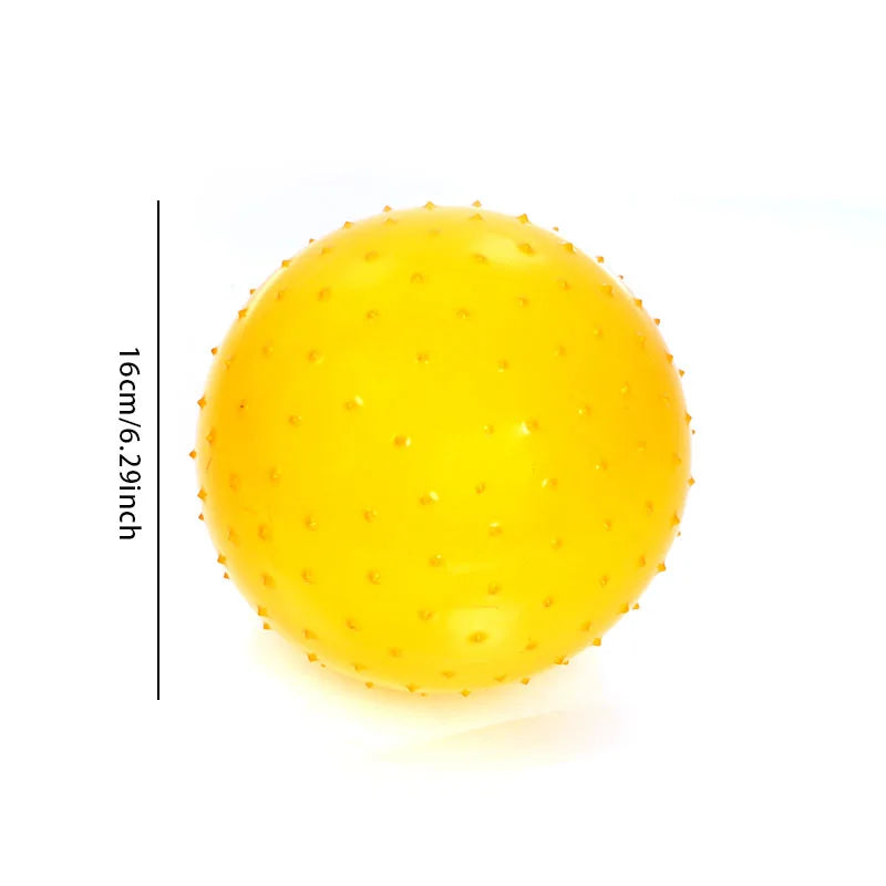 A bright yellow inflatable sensory ball with small bumps, shown against a white background.