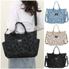 Three floral canvas tote bags in black, light blue, and beige displayed against a white background.