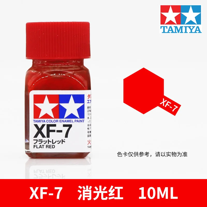 Tamiya XF-7 Flat Red enamel paint in a glass bottle, labeled for model building.
