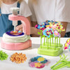 A craft kit showing various fabric flowers and green stems for a DIY bouquet project.