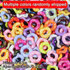 A close-up of multiple colors of 16mm wave-patterned acrylic beads randomly shipped for jewelry making