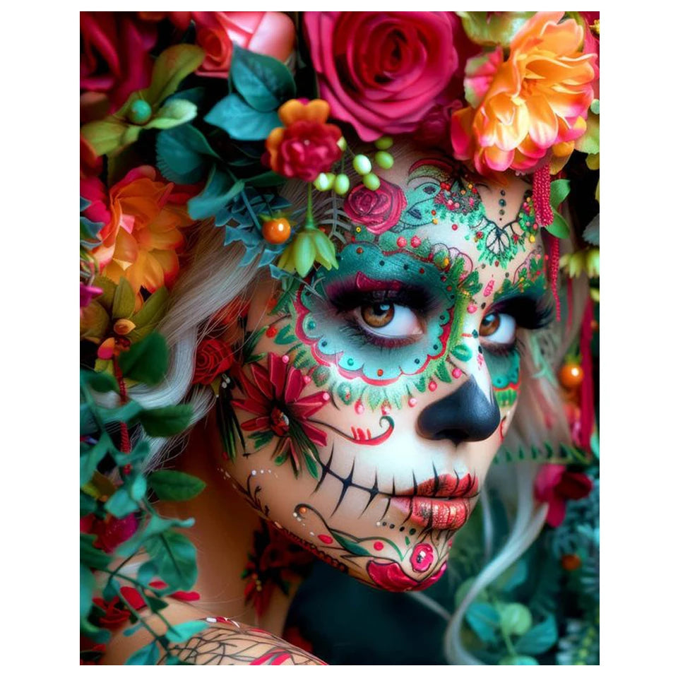 Close-up of a woman with intricate floral and skull face paint designs, surrounded by vibrant flowers and greenery.