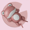 A pink wind-up swimming duck bath toy for toddlers with large eyes and paddle feet.