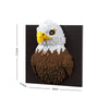 A model of an owl built from black and white LEGO bricks, featuring a yellow beak and brown body.