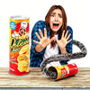 A woman is excitedly holding a can of Delicious Chips while a snake-themed prank product is visible nearby.