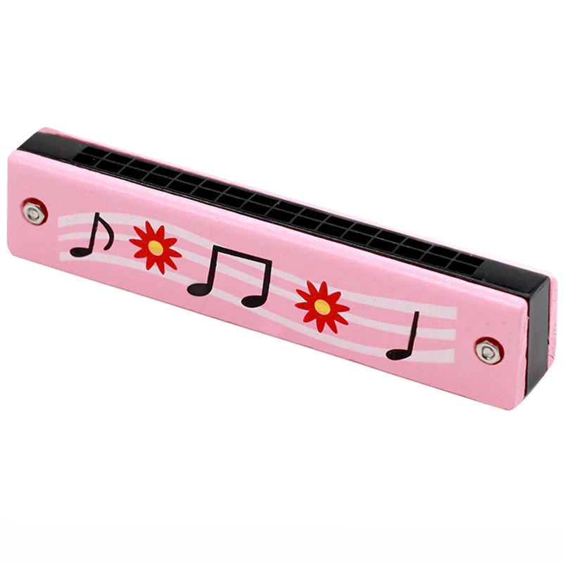 Pink wooden harmonica with a cartoon animal design featuring musical notes and flowers.