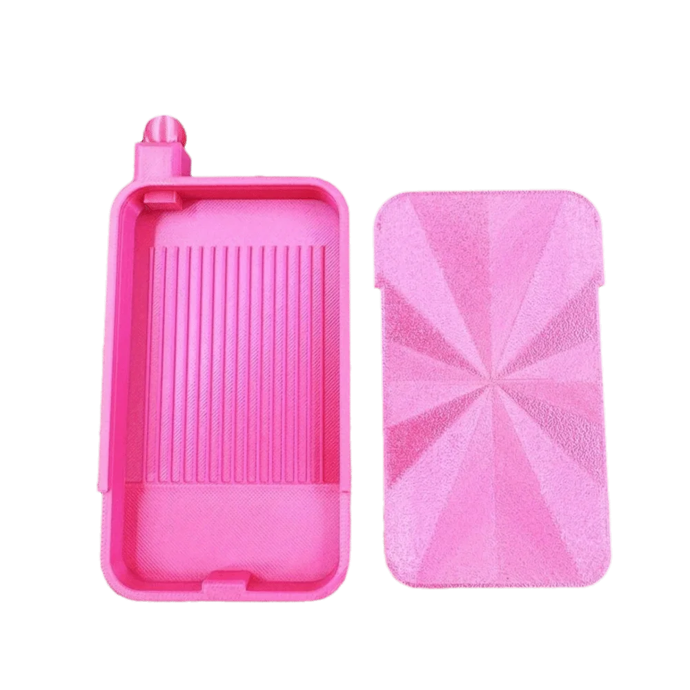 A pink large diamond painting tray with a pop-up plug for bead sorting shown in two pieces.