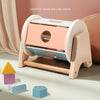 A wooden desktop shape rolling drum with various colored blocks and a wooden handle for sensory play.