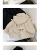 A black hooded zip-up jacket with a white text print on the chest and a beige version of the same jacket.