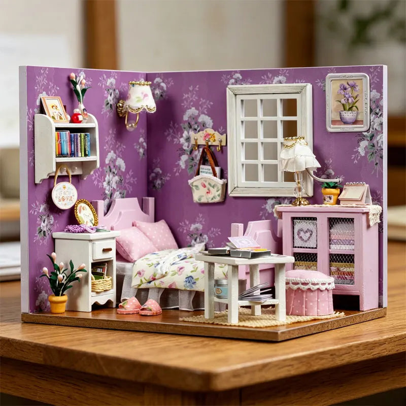 A DIY wooden miniature dollhouse kit featuring pink and purple furniture set against a floral background.