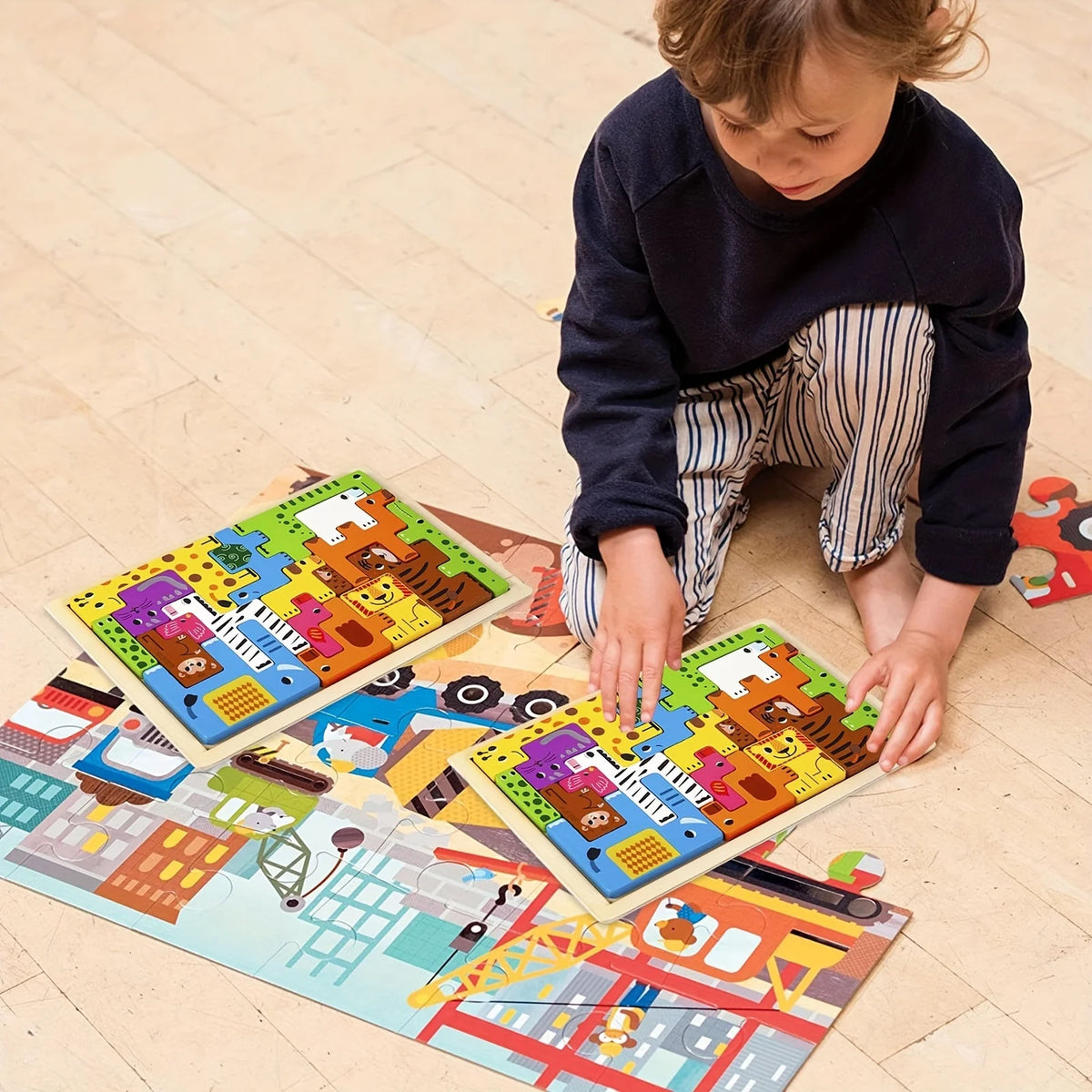 A young child is assembling a wooden tangram puzzle set featuring animals, vehicles, and sea life on the floor.