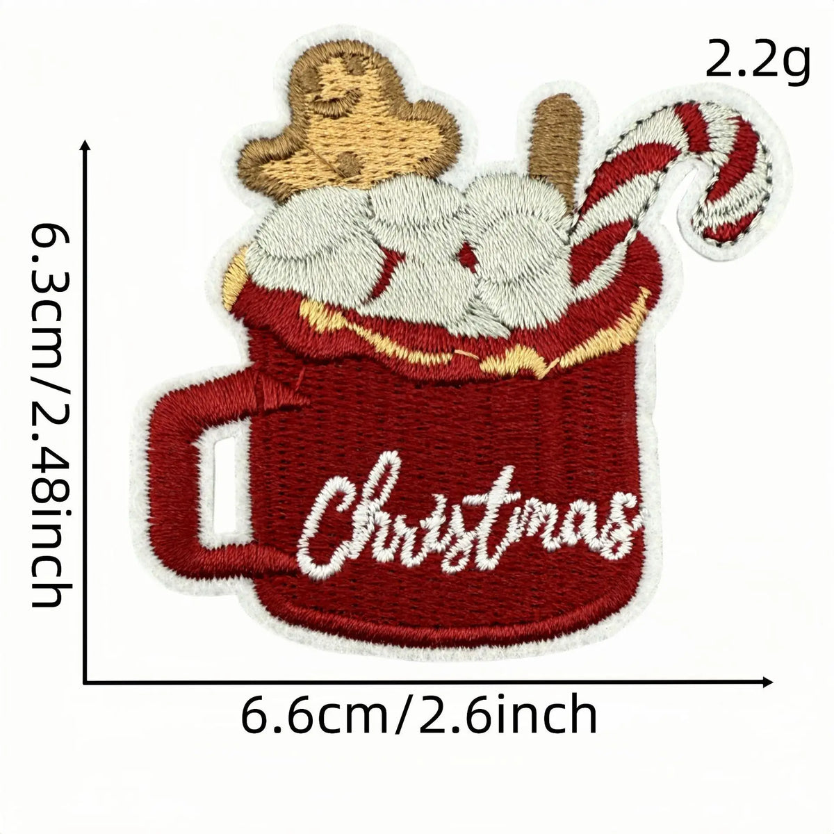 A festive cartoon character iron-on patch depicting a red mug filled with whipped cream and a striped marshmallow topping.