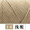 A close-up of a beige yarn, likely milk cotton, shown in a twisted or cable knit texture.