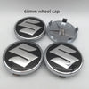 Four 68mm Suzuki wheel cap covers are displayed, showing the silver and black design.