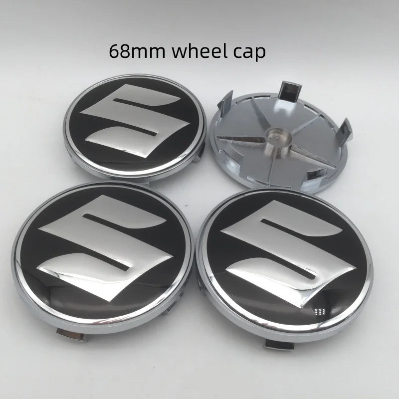 Four 68mm Suzuki wheel cap covers are displayed, showing the silver and black design.