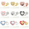 A set of pink and gold baby pacifiers and clips with rhinestone accents displayed on a white background.