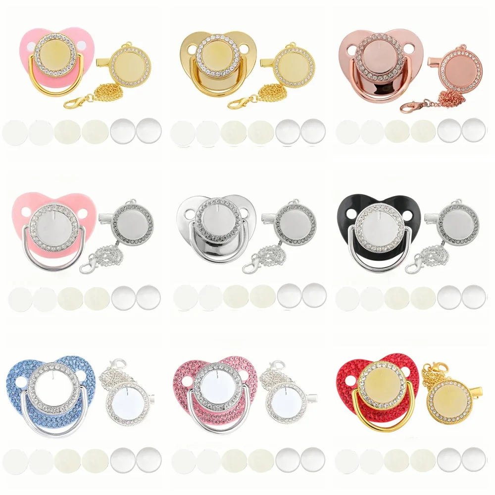 A set of pink and gold baby pacifiers and clips with rhinestone accents displayed on a white background.