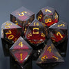 A collection of seven polyhedral dice made of red liquid core resin set against a dark background.