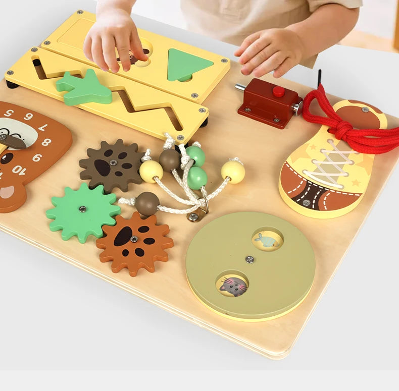 A wooden busy board for children featuring various musical and sensory activities like puzzles and levers.