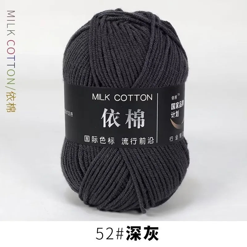 A skein of dark gray milk cotton yarn labeled with Chinese text and a size designation.