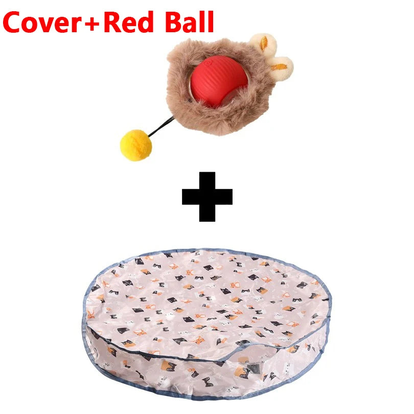 A cover and red ball toy with a fluffy hide and seek cat toy and a pink patterned mat.