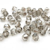 A collection of clear faceted bicone crystal glass beads for jewelry making