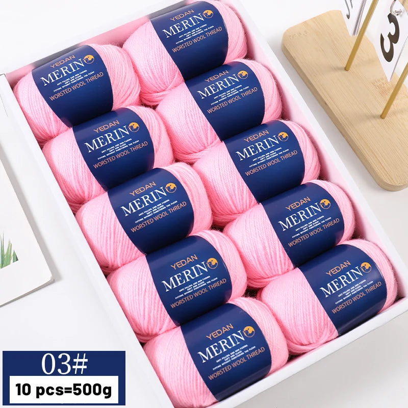 A box of ten skeins of pink Merino wool yarn for knitting sweaters, scarves, and hats.