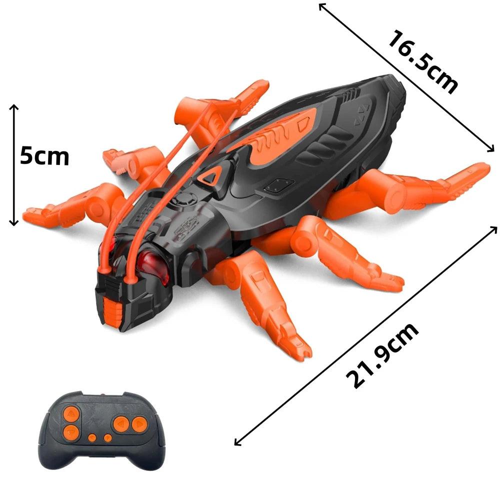 An orange and black remote control wall-climbing lizard robot toy with LED eyes shown from above.