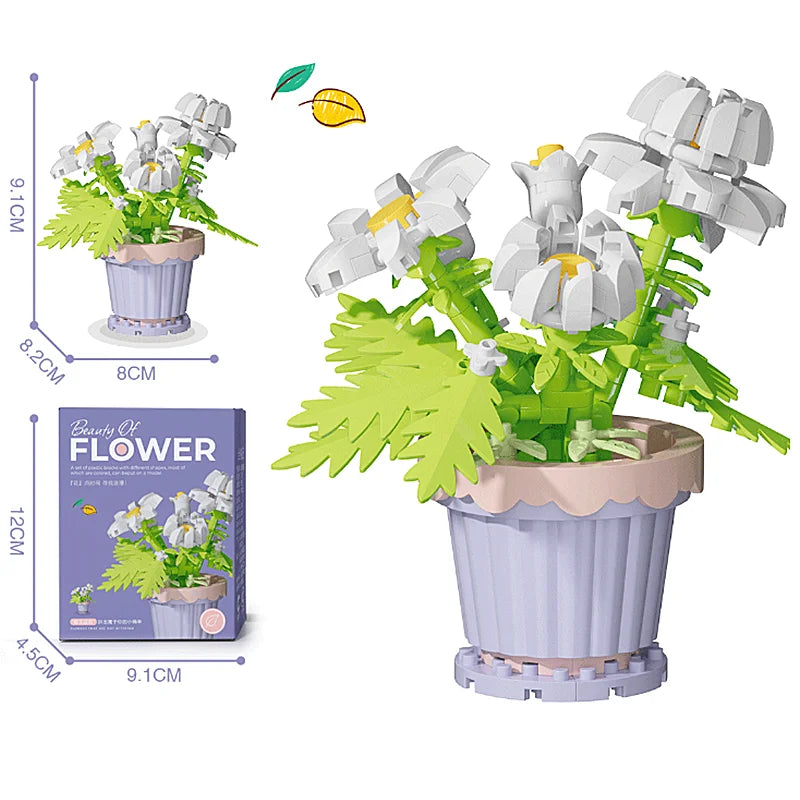 A building block flower bouquet kit showing a white flower in a purple pot and accompanying leaves.