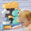 A baby is playing with a dinosaur bath toy sprinkler that sprays water into a bathtub.