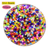 A circular arrangement of 5mm colored plastic beads in various shades including pink, purple, green, yellow, and orange.