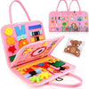 Pink Montessori felt activity busy book for toddlers featuring a dinosaur theme with various colorful felt pieces