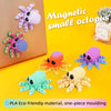 A collection of plastic octopus magnets in various colors including purple, orange, blue, and green on a yellow background.