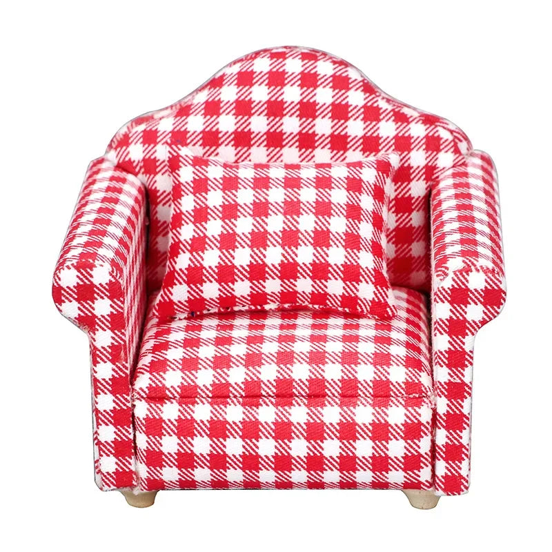 A red and white checkered mini sofa and pillow set for a dollhouse