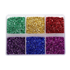 A clear plastic tray filled with various colors of crushed glass stones for resin and craft projects.