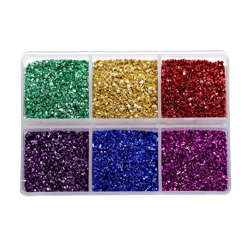 A clear plastic tray filled with various colors of crushed glass stones for resin and craft projects.