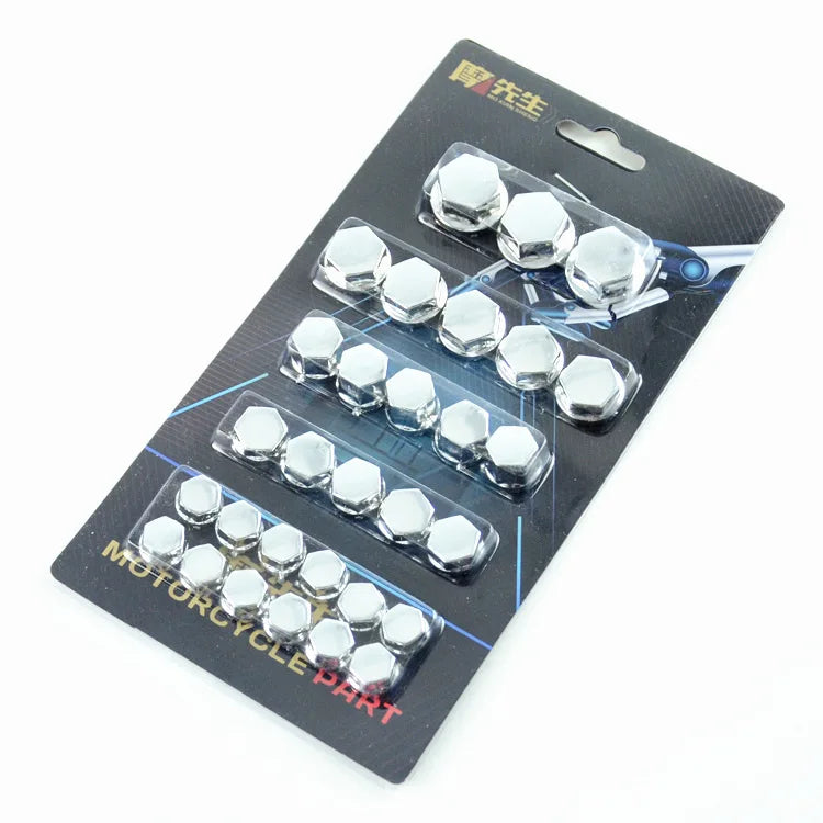 A set of silver decorative caps for motorcycle screws packaged on a black card.