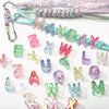 A collection of colorful acrylic alphabet beads in various shades and shapes for jewelry making