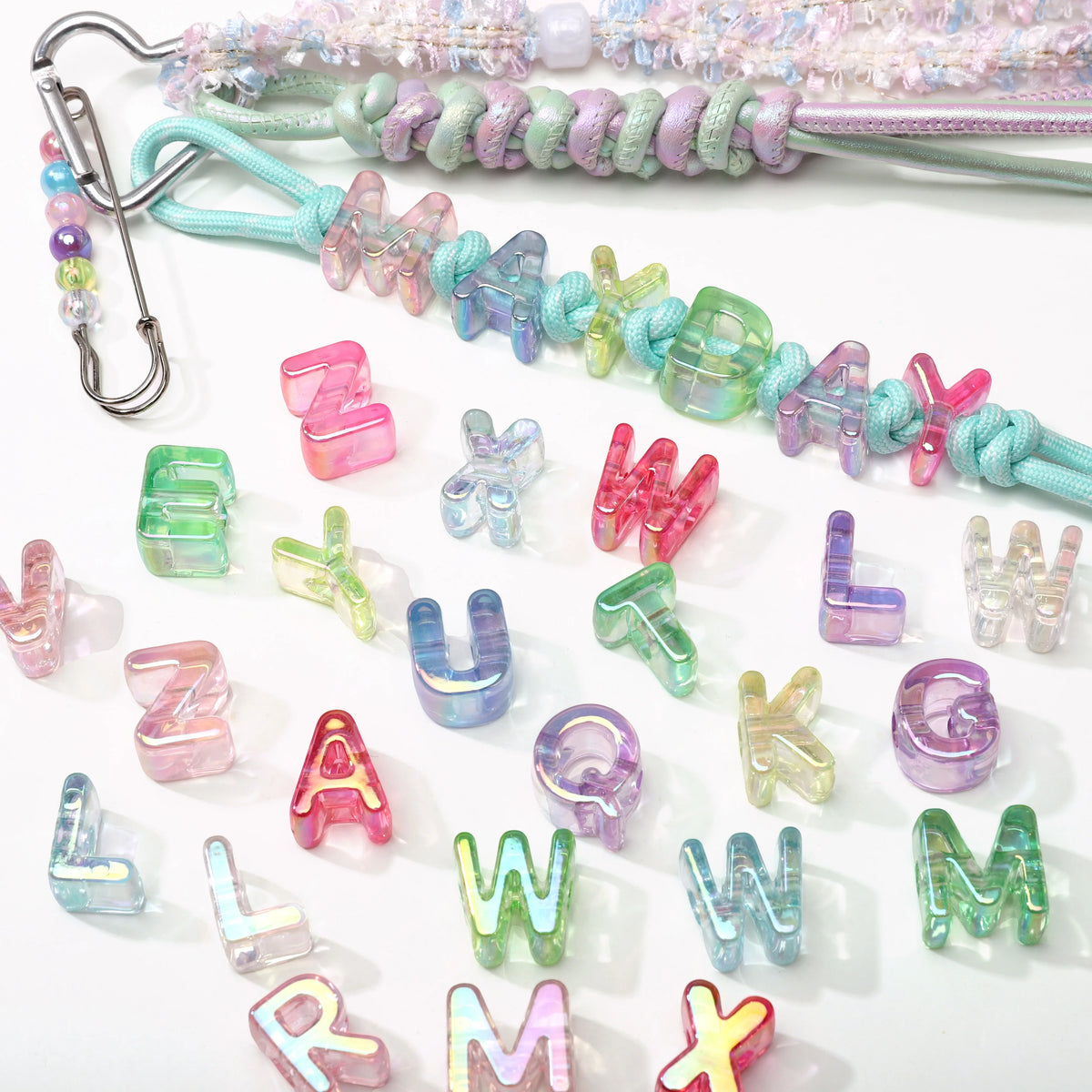 A collection of colorful acrylic alphabet beads in various shades and shapes for jewelry making