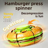 A green and brown burger-shaped spinner toy used for decompression and fun.