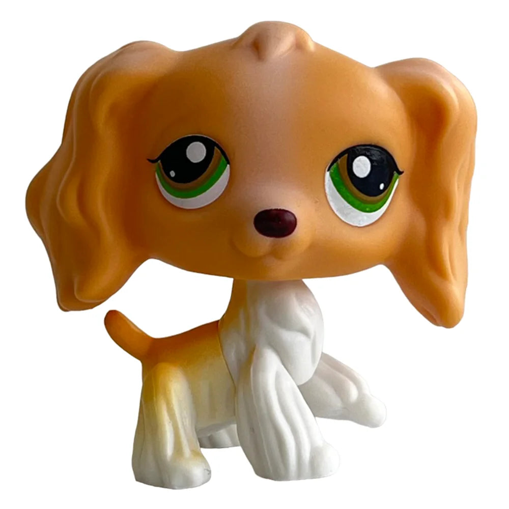 A charming bobblehead figurine of a dog, resembling a dachshund or kitten, with light brown and white fur.