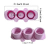 Pink flexible silicone mold with multiple sized plant pots and a separate small pot.