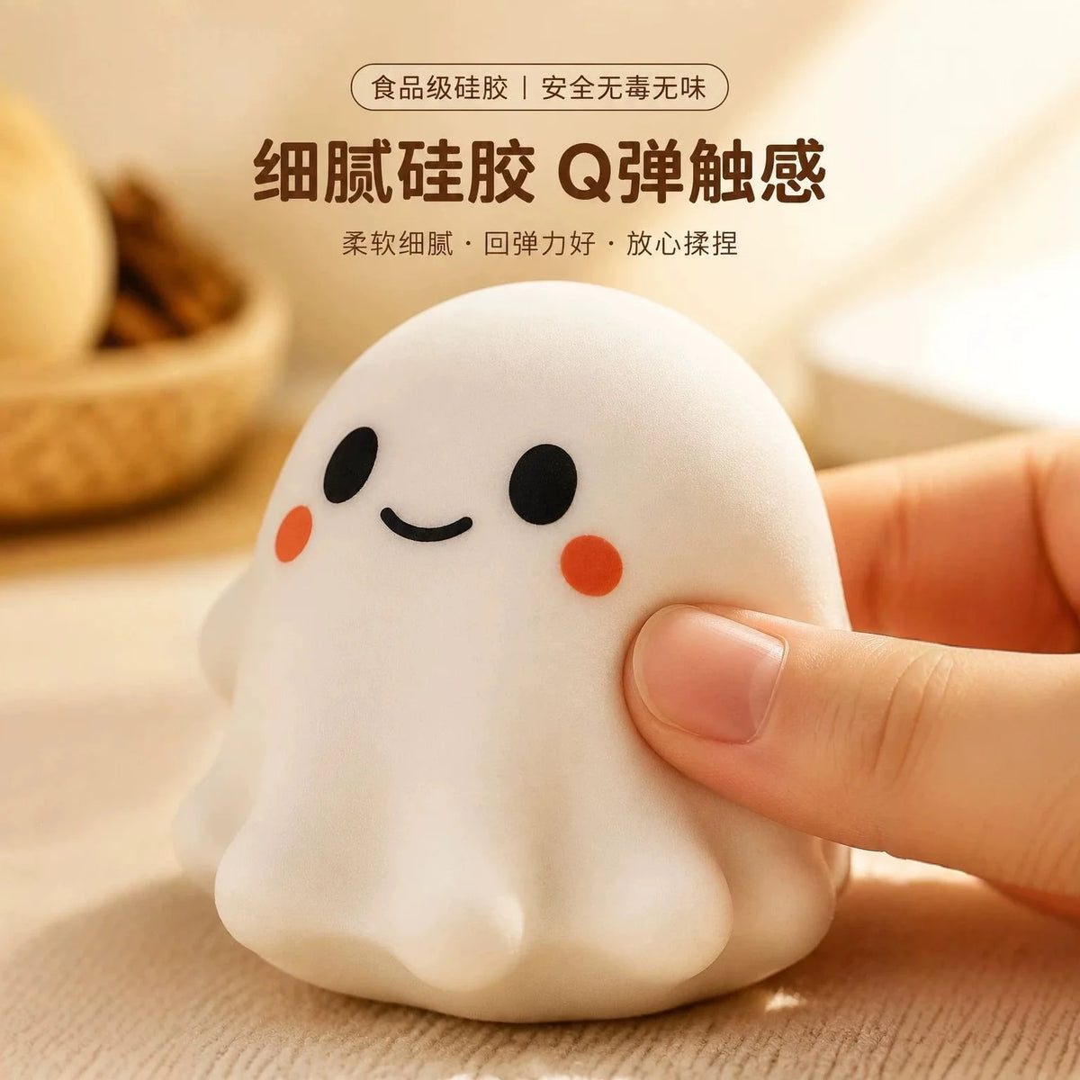 A hand is squeezing a white, squishy ghost-shaped stress ball fidget toy on a wooden surface.