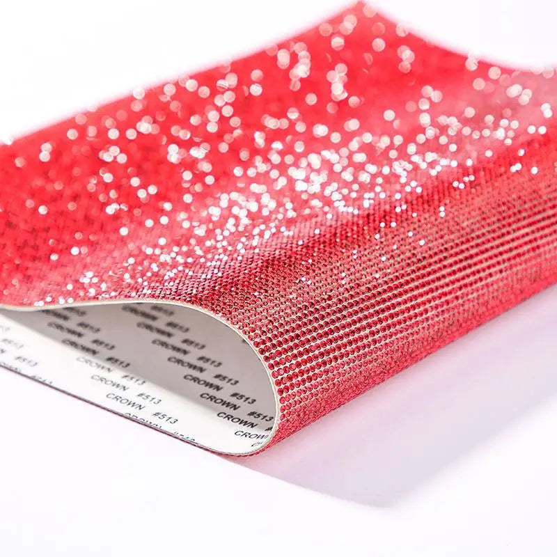 Roll of sparkling red rhinestone adhesive tape for DIY crafts and decor