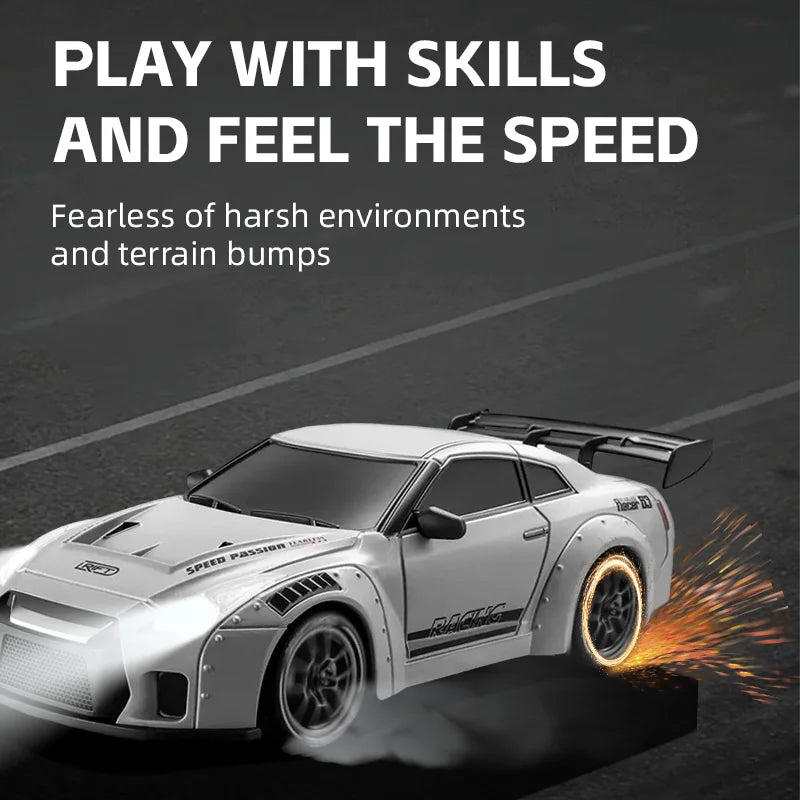 A white RC drift car is shown speeding on a track, with tire smoke visible.